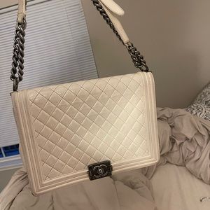 White Chanel Bag. You can get it cleaned.
